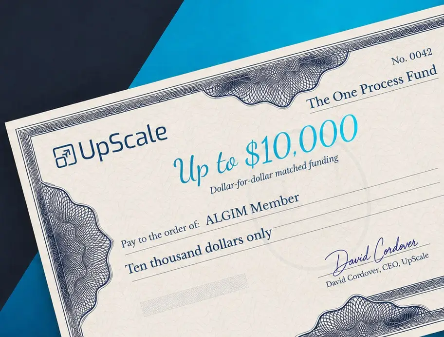 A cheque from The One Process Fund: up to $10,000 in dollar-for-dollar matched funding, payable to an ALGIM member, signed by David Cordover, CEO, UpScale